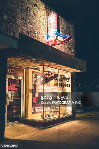 vibrant rainy street historic district in austin-texas at night - storefront-for-art-and-architecture stock pictures, royalty-free photos & images