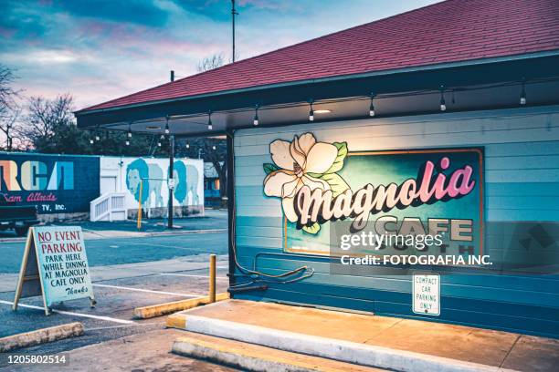 vibrant rainy street historic district in austin-texas at night - austin nightlife stock pictures, royalty-free photos & images