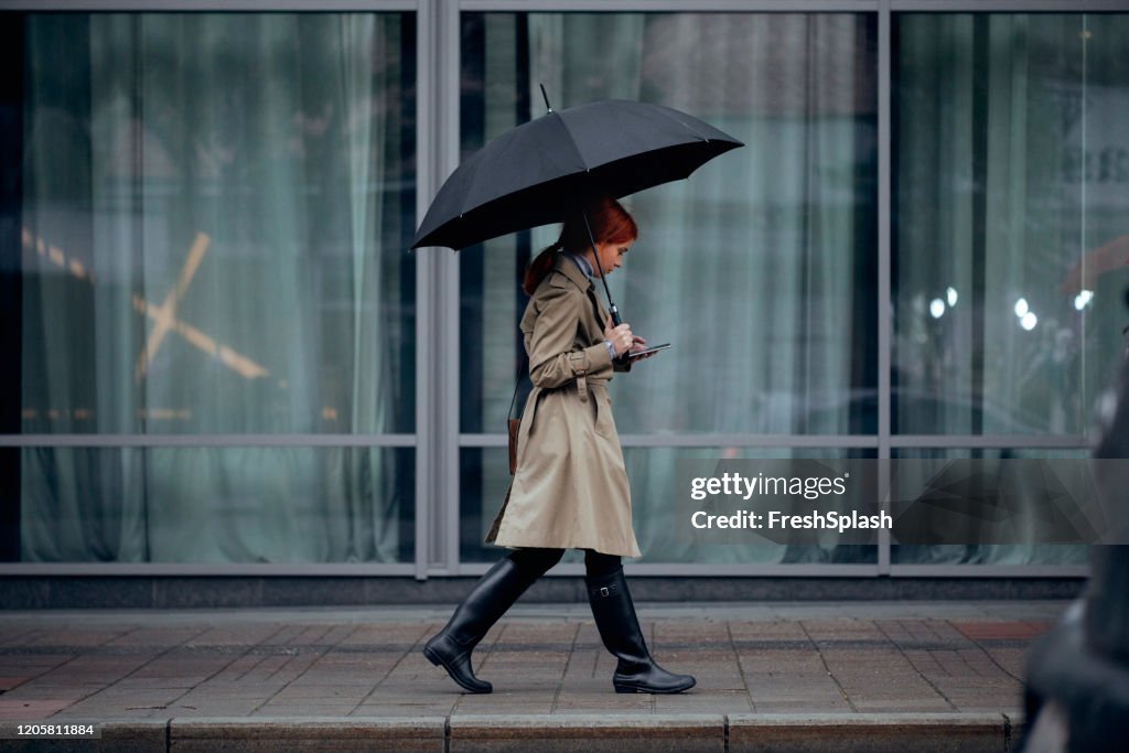 A Woman Walking With Umbrella High-Res Stock Photo - Getty Images
