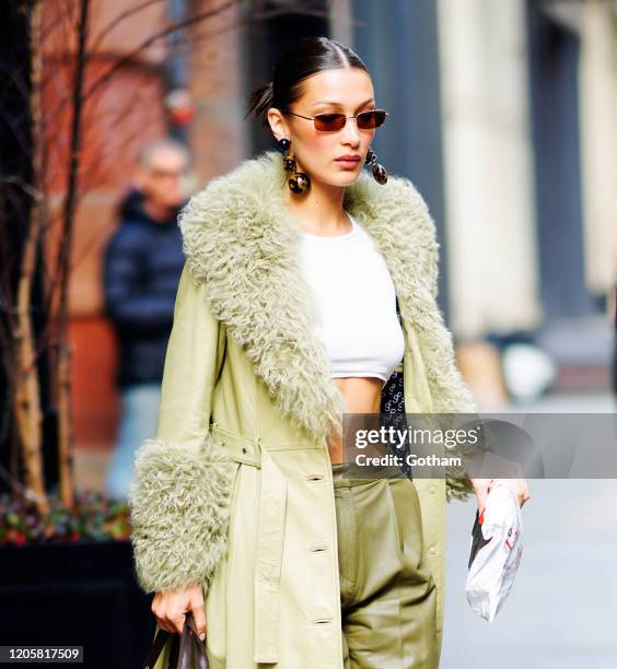 Bella Hadid wears all green on February 12, 2020 in New York City.