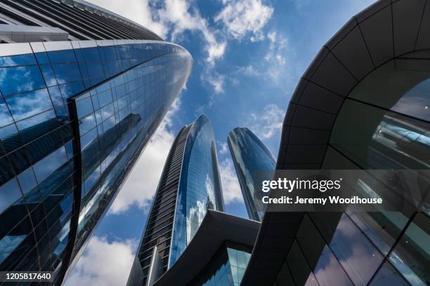 view looking up at the etihad towers - abu dhabi business stock pictures, royalty-free photos & images