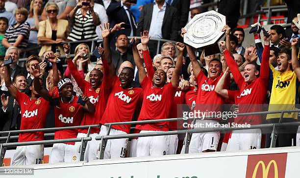 Nemanja Vidic of Manchester United lifts the Community Shield after victory in the FA Community Shield match sponsored by McDonald's between...