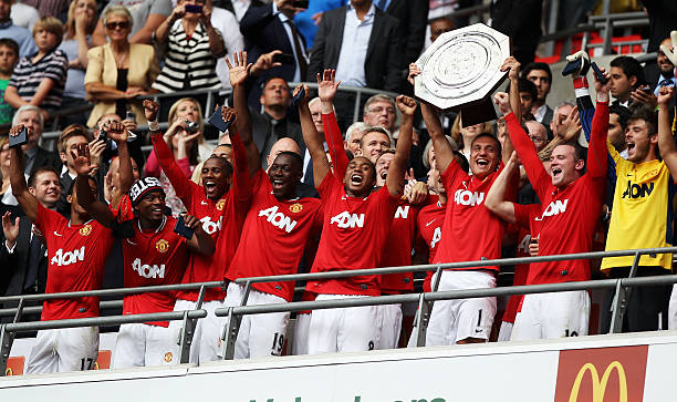 Nemanja Vidic of Manchester United lifts the Community Shield after victory in the FA Community Shield match sponsored by McDonald's between...