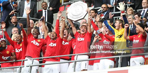 Nemanja Vidic of Manchester United lifts the Community Shield trophy after the FA Community Shield match between Manchester City and Manchester...