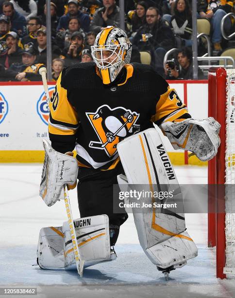 Matt Murray of the Pittsburgh Penguins defends the net against the Tampa Bay Lightning at PPG PAINTS Arena on February 11, 2020 in Pittsburgh,...