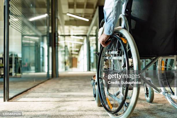 wheeling his way into recovery - mobility disability stock pictures, royalty-free photos & images