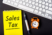 Sales Tax - from the consumer at the point of purchase or online shop. Shopping and taxation. Workplace of an accountant