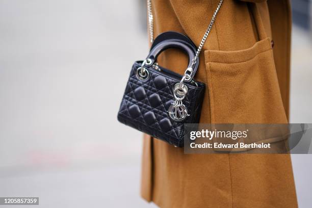 Guest wears a black leather quilted Lady Dior bag, during New York Fashion Week Fall Winter 2020, on February 12, 2020 in New York City.