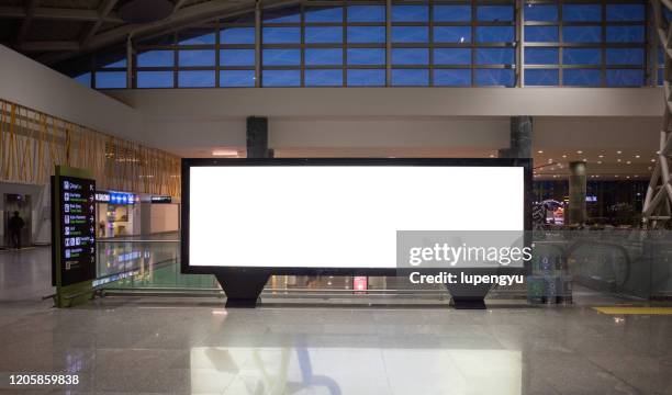 blank billboard at airport - blank billboard stockfoto's en -beelden