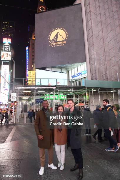 Actors Jeremy Tardy, Cristina Rodlo and Sam Keeley pose in front of the 68 Whiskey billboard in Times Square during the Paramount Network 68 Whiskey...