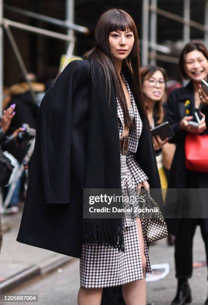 Mariya Nishiuchi is seen wearing a Michael Kors dress outside the Michael Kors show during New York Fashion Week: A/W20 on February 12, 2020 in New...