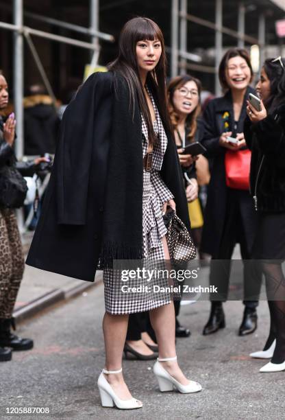 Mariya Nishiuchi is seen wearing a Michael Kors dress outside the Michael Kors show during New York Fashion Week: A/W20 on February 12, 2020 in New...