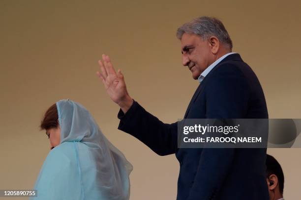 Pakistan Army Chief General Qamar Javed Bajwa waves during the Pakistan Super League T20 cricket match between Islamabad United and Multan Sultan's...