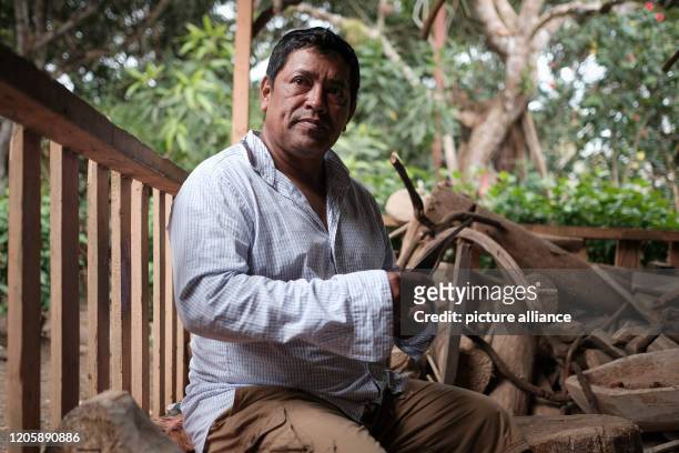 March 2020, Nicaragua, Solentiname: José Francisco Peña, a Solentiname resident, works the wood for the raft that the Solentiname residents carve to...