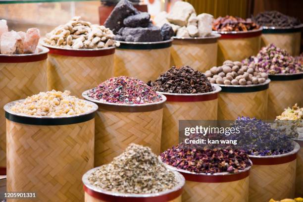 bags of colorful spices for sale at the souq - stock photo - frankincense stock pictures, royalty-free photos & images