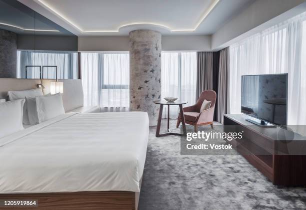 luxury bedroom in a hotel suite - luxury hotel room stock pictures, royalty-free photos & images