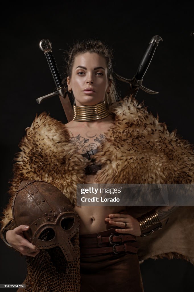 Blonde viking warrior female in studio shot