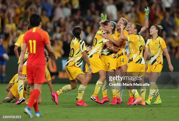 Emily van Egmond of the Matildas celebrates scoring a goal with team mates during the Women's Olympic Football Tournament Qualifier between Australia...