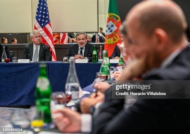 Ambassador to Portugal, George Edward Glass listens to US Secretary of Energy, Dan Brouillette , delivering opening remarks during the meeting with...