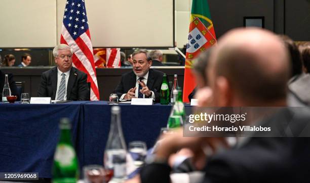 Ambassador to Portugal, George Edward Glass listens to US Secretary of Energy, Dan Brouillette , delivering opening remarks during the meeting with...