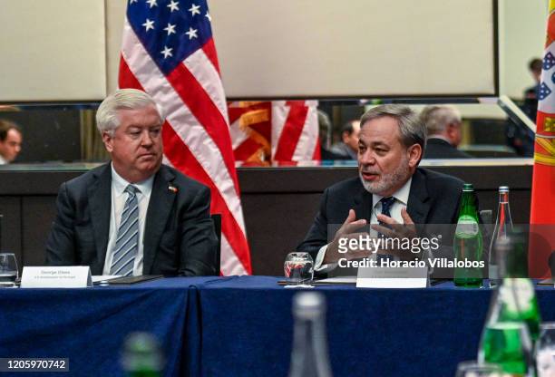 Ambassador to Portugal, George Edward Glass listens to US Secretary of Energy, Dan Brouillette , delivering opening remarks during the meeting with...