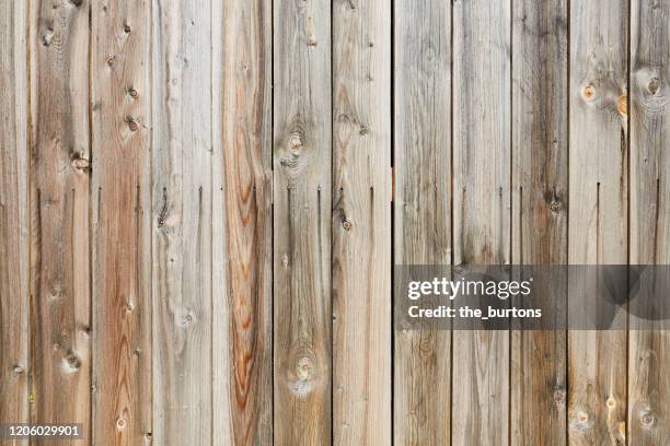 full frame shot of weathered wooden wall - tool shed wall spaces stockfoto's en -beelden