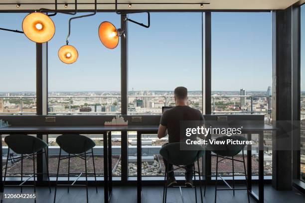 View of sky lounge looking out over the city. Highpoint - Newington Butts, Elephant and Castle, United Kingdom. Architect: Rogers Stirk Harbour +...