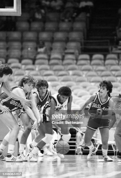 S Cheryl Miller, right, battles and then comes away with the ball by taking it away from Yugoslavia's Polona Dornik and Zagorka Pocekovic , during...