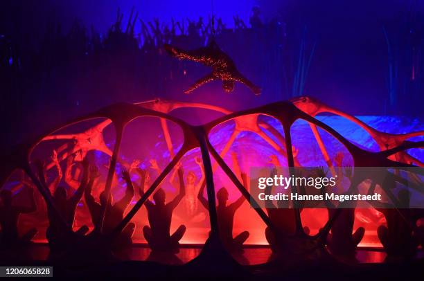 Canadian circus troop "Cirque du Soleil" performs in their acrobatic performance during the premiere of "Totem" by Cirque du Soleil at Theresienwiese...