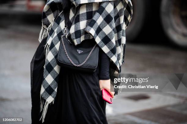 Guest is seen wearing Prada bag outside Gabriela Hearst during New York Fashion Week Fall / Winter on February 11, 2020 in New York City.