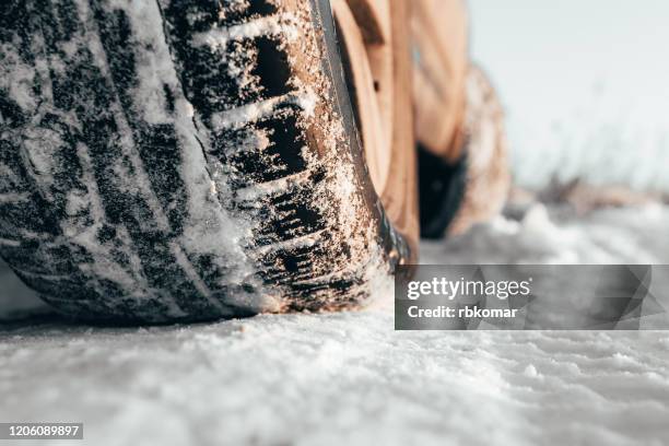 winter tires outdoor close-up - schneewehe stock-fotos und bilder