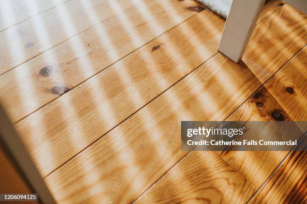 sun streams across floor - floorboards stock pictures, royalty-free photos & images