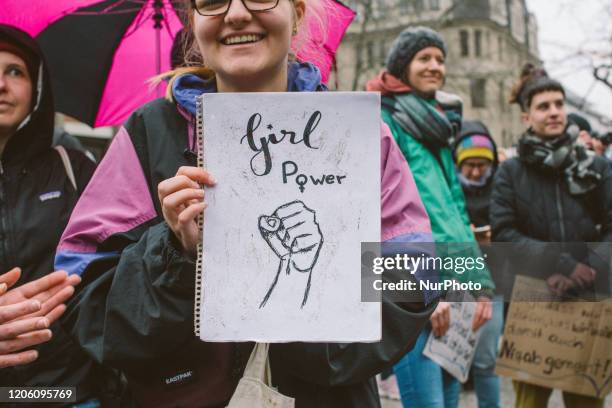 Girl hold a note written''Girl power'' during the International women's march in Cologne, Germany, on March 8, 2020.