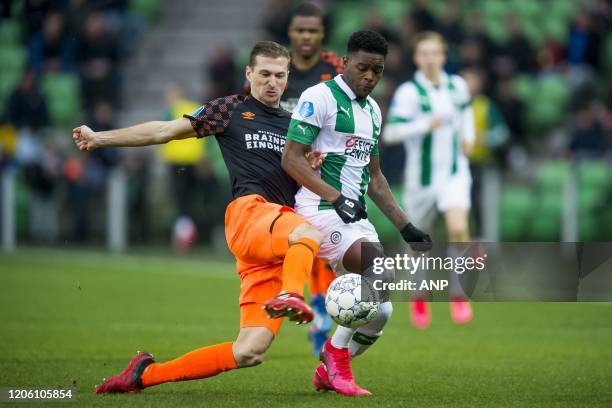 Daniel Schwaab of PSV, Daishawn Redan of FC Groningen during the Dutch Eredivisie match between FC Groningen and PSV Eindhoven at Hitachi Capital...