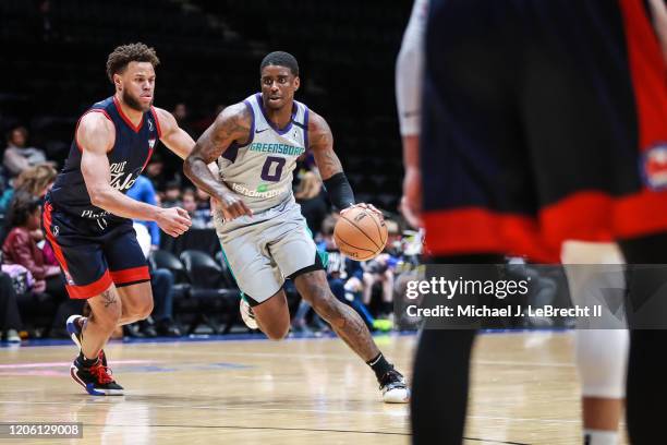 Dwayne Bacon of the Greensboro Swarm dribbles the ball against the Long Island Nets during an NBA G-League game on March 8, 2020 at Nassau Veterans...