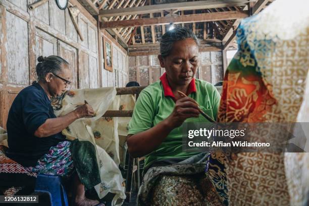 making batik, indonesian traditional cloth - yogyakarta stock pictures, royalty-free photos & images