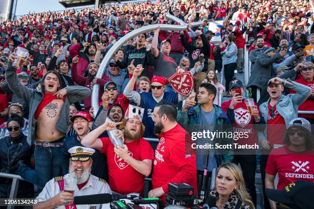 Defenders fans cheer as they form a beer cup snake during the second half of the XFL game between the DC Defenders and the St. Louis Battlehawks at...