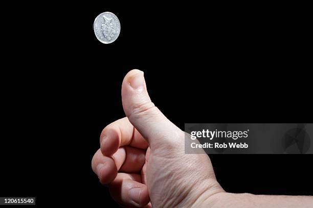coin toss - münzwurf stock-fotos und bilder