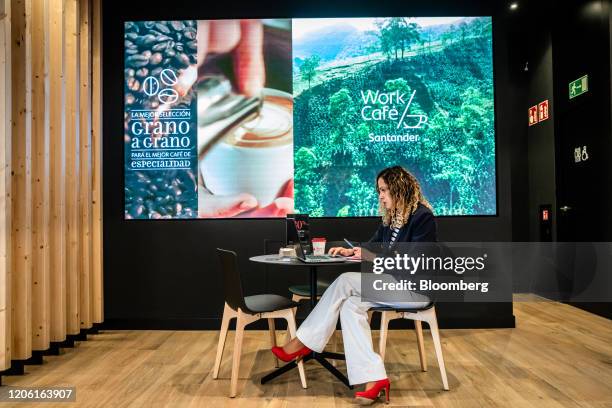 Visitor works at a laptop computer inside the Banco Santander SA Work Cafe co-working space in Barcelona, Spain, on Friday, March 6, 2020. Spanish...