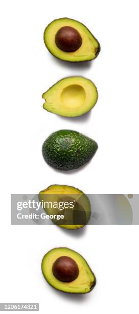 half avocado on white background - avocado slices stock pictures, royalty-free photos & images