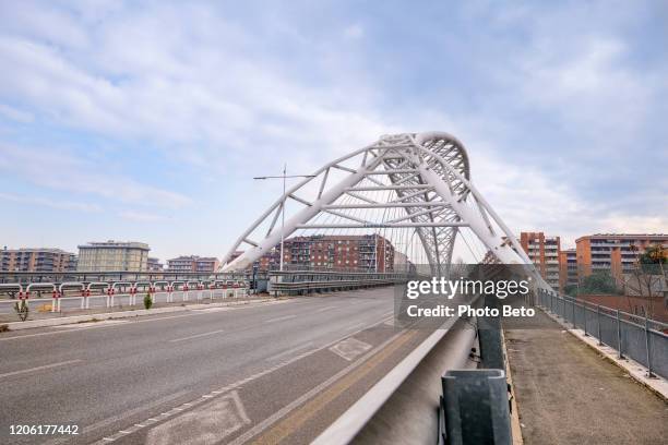 the modern arched structure of the settimia spizzichino road bridge in the ostiense district in southern rome - gas container stock pictures, royalty-free photos & images