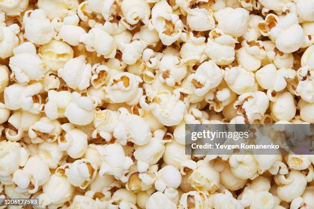 scattered popcorn texture background - caramel corn stock pictures, royalty-free photos & images