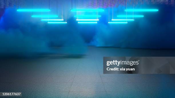 empty pit garage with blue smoke - blue smoke stock pictures, royalty-free photos & images