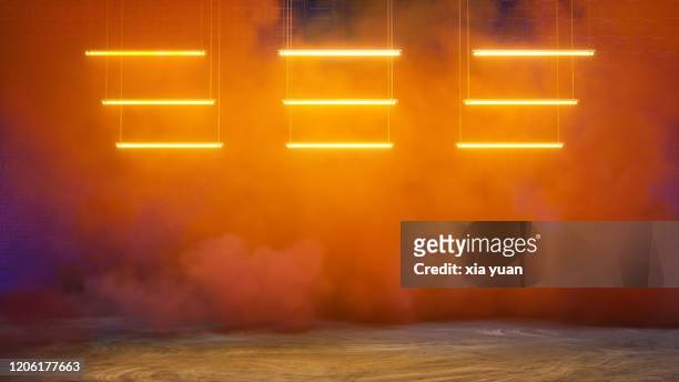 empty pit garage with colored smoke - orange colour stock-fotos und bilder