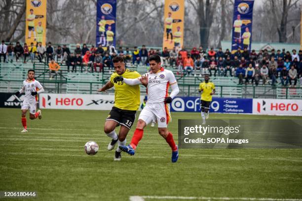 Robin Singh of Real Kashmir and Jhonny Acosta of West Bengal are seen in action during a league match between Real Kashmir and West Bengal at TRC...