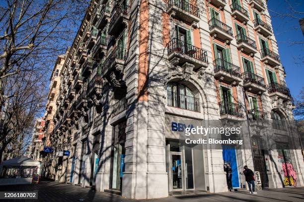 Banco Bilbao Vizcaya Argentaria SA bank branch stands in Barcelona, Spain, on Saturday, March 7, 2020. Spanish bank shares soared after the European...