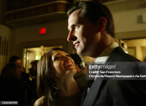 Party14_081_df.JPG ;Mayor Gavin Newsom and his wife Kimberly Guilfoyle are photographed by camera crews as they arrive. The mayor is in the national...