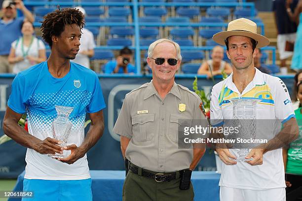 Gael Monfils of France and Radek Stepanek of the Czech Republic pose with Steve LeBell of the national Park Service during the trophy after the final...