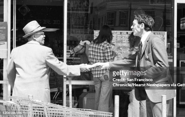 Harvey Milk passes out fliers at a San Francisco Safeway grocery store during his 1976 State Assembly run.