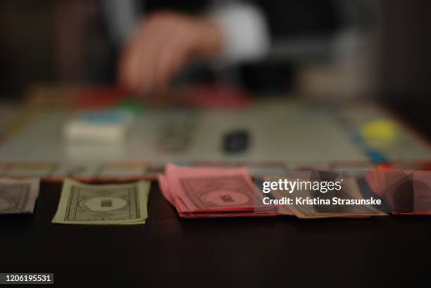 a child playing a board game - norway money stockfoto's en -beelden